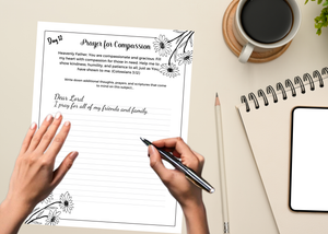 Hands holding printed pages of the Daily Prayer Journal, ready to start a devotional session.