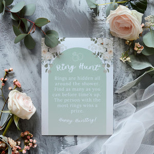 DIY bridal shower ring hunt game with a stylish green floral layout.
